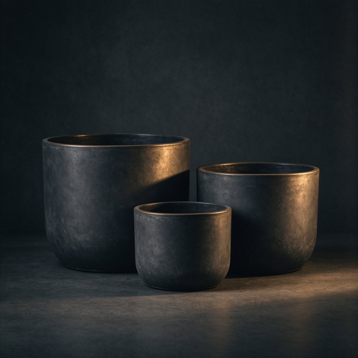 Char Planter Trio, weatherproof matte charcoal planters in graduated sizes, with drainage trays
